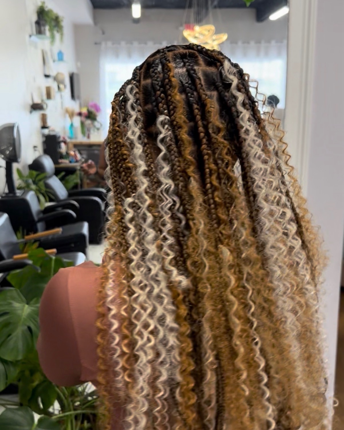Blonde boho knotless braids styled at Royal Touch Studio