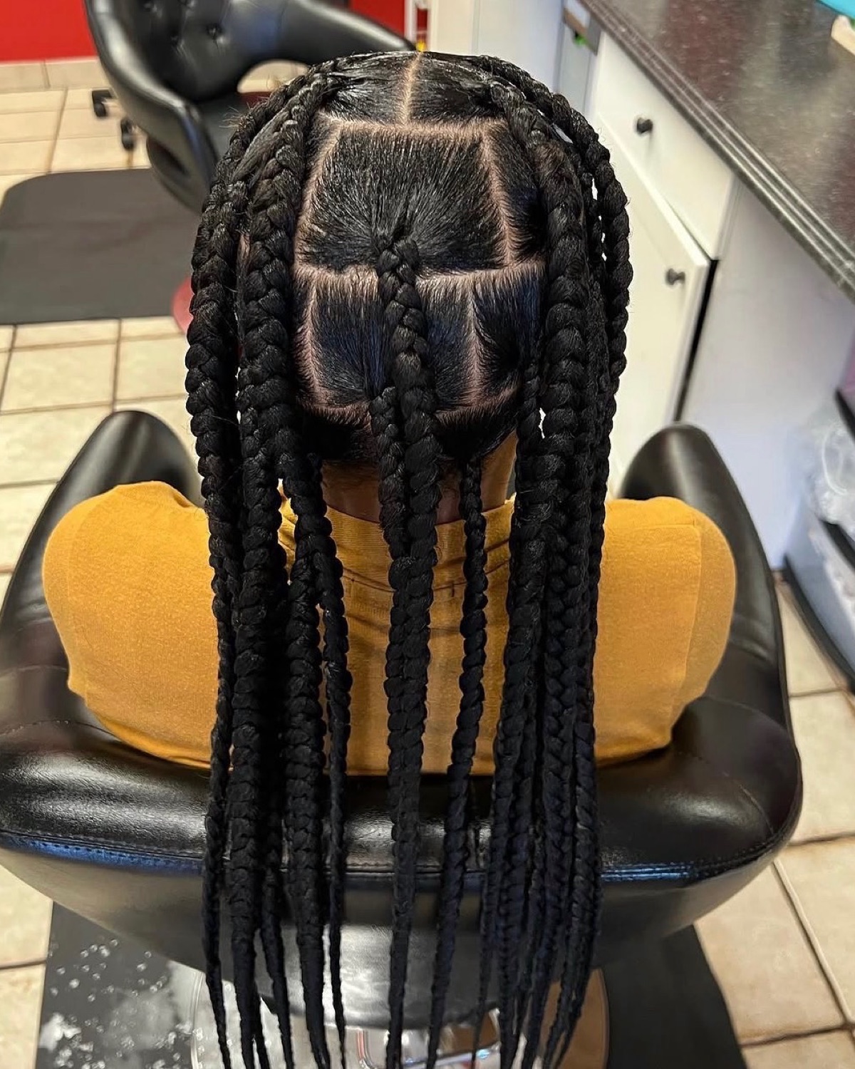 Large box braids styled at Royal Touch Studio