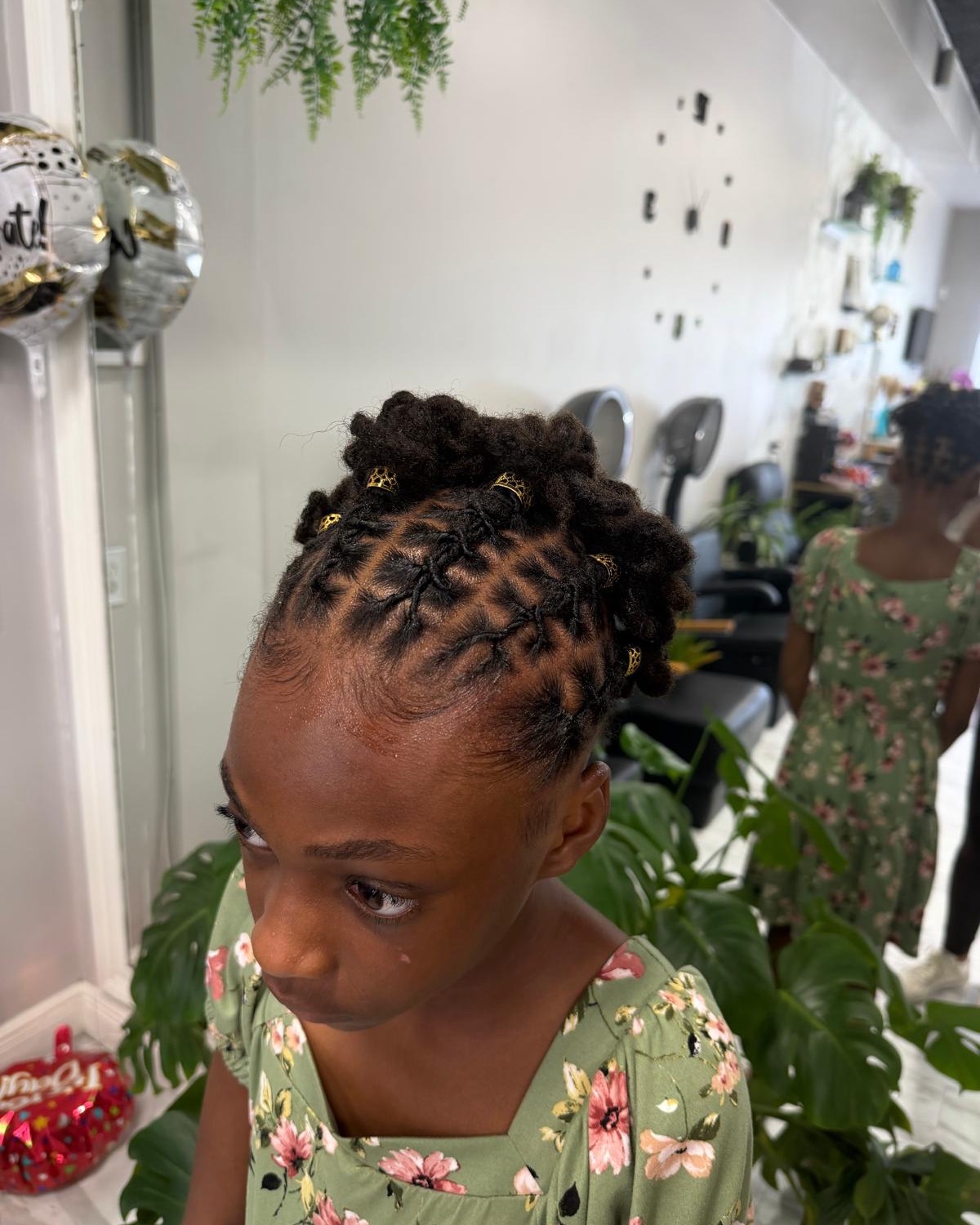 Loc updo with gold cuffs, front view styled at Royal Touch Studio